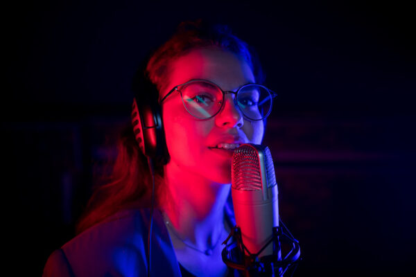 Young singer recording in the studio