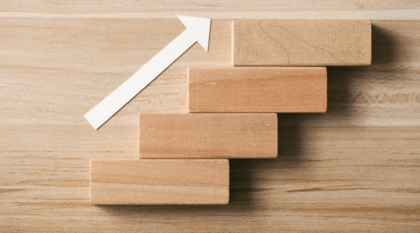Wood blocks with arrow going up like steps