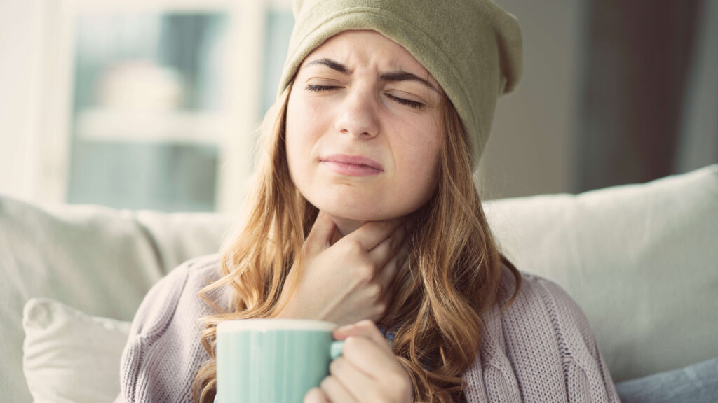 female vocal artist struggling with her vocal health