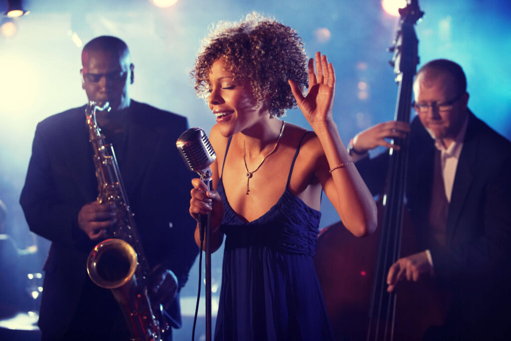female vocal artist performing with a healthy singing voice
