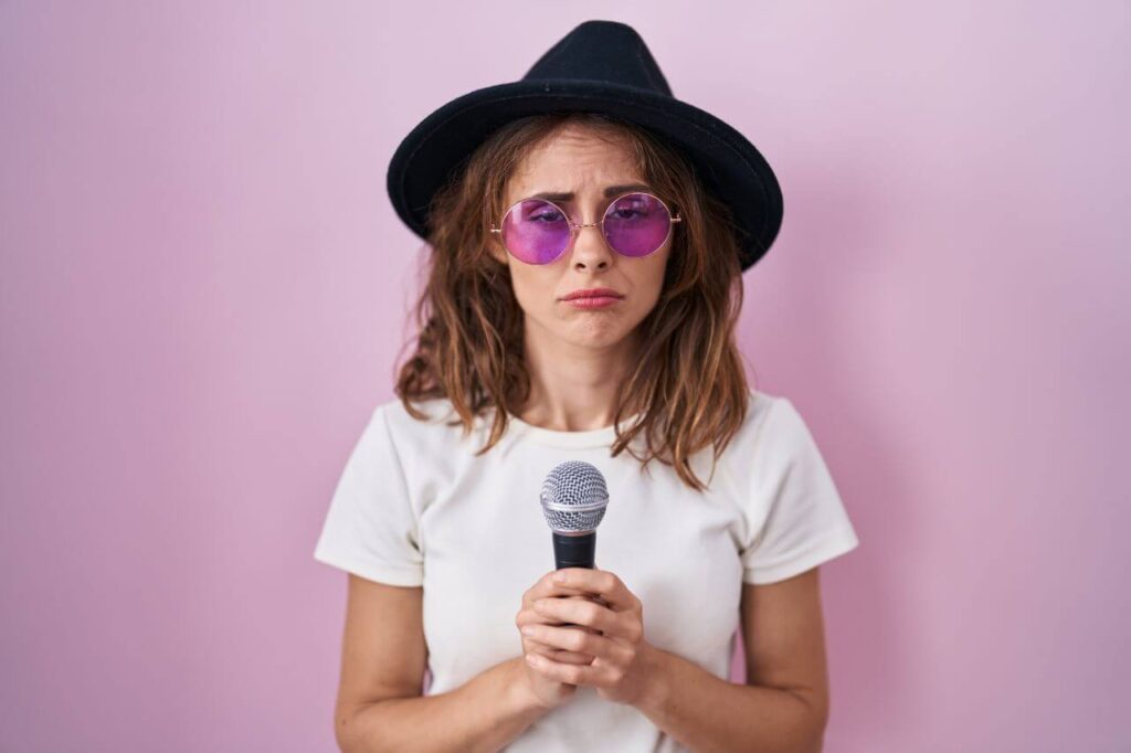female vocal artist fed up with vocal strain