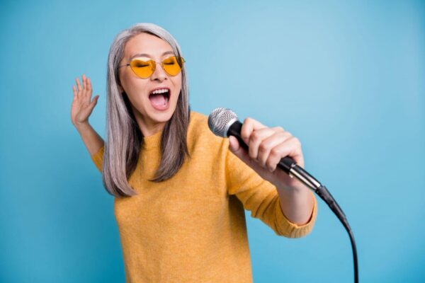 female vocal artist singing high notes